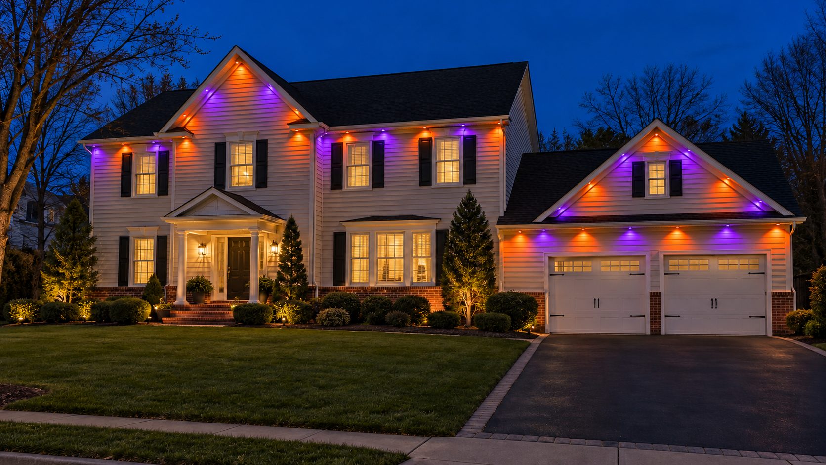 The same house lit orange and purple for Halloween